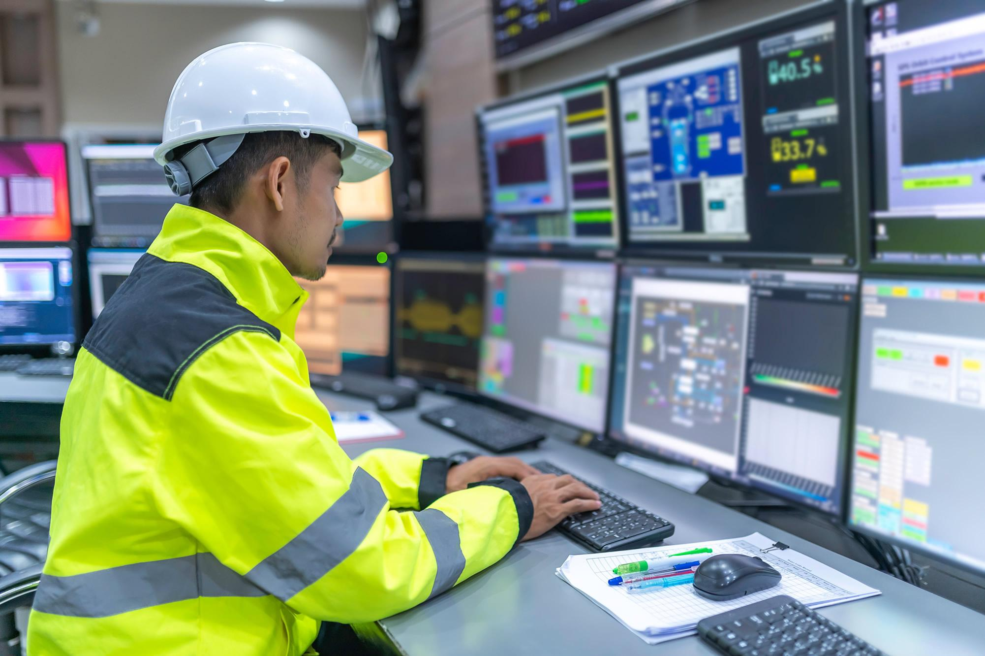 Technical worker using a digital tablet in an industrial environment